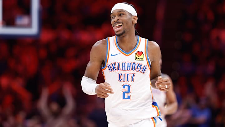 Shai Gilgeous-Alexander driving to the basket in OKC Thunder's playoff game