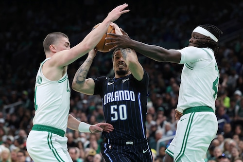 Al Horford battles Orlando Magic defenders during NBA playoffs