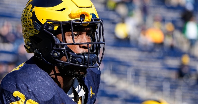 Kalel Mullings celebrating his NFL Draft selection with Michigan teammates