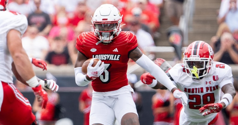 Quincy Riley drafted by the New Orleans Saints, celebrating on the field.