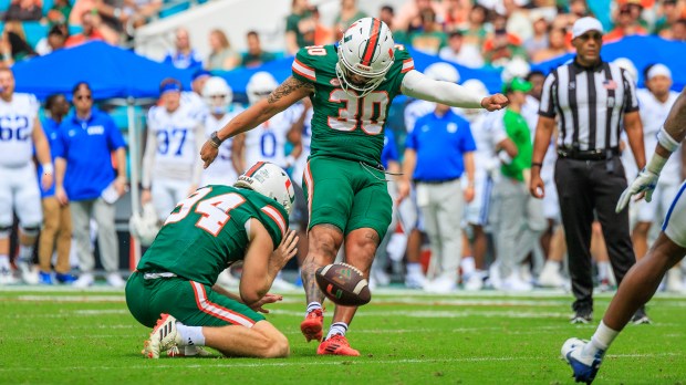 Andres Borregales prepares to kick during a Miami Hurricanes game