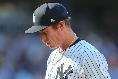 Yankees pitcher Tim Hill prepares to throw a pitch