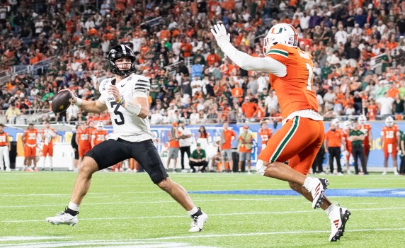 Francisco Mauigoa celebrates after a big play for the Miami Hurricanes
