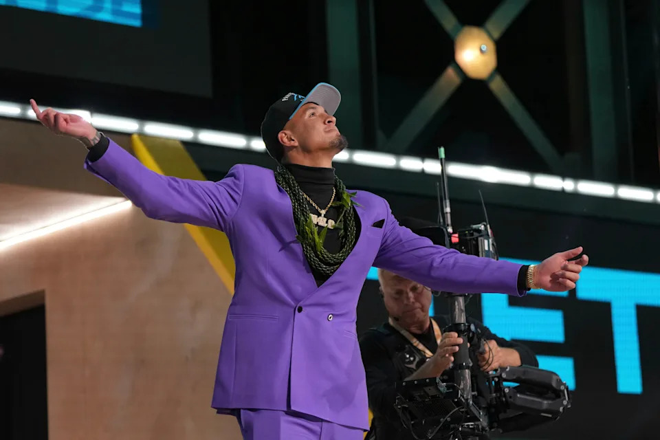 Jaxson Dart celebrates his selection in the 2025 NFL Draft