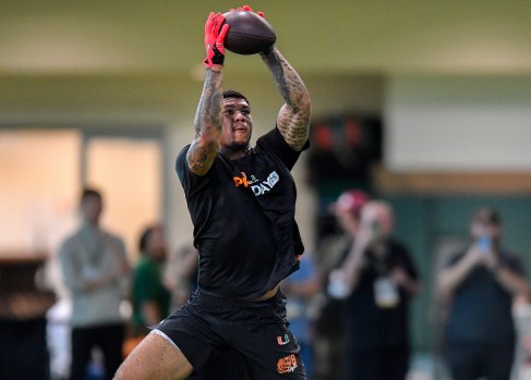 Elijah Arroyo celebrates after making a key catch for the Miami Hurricanes.