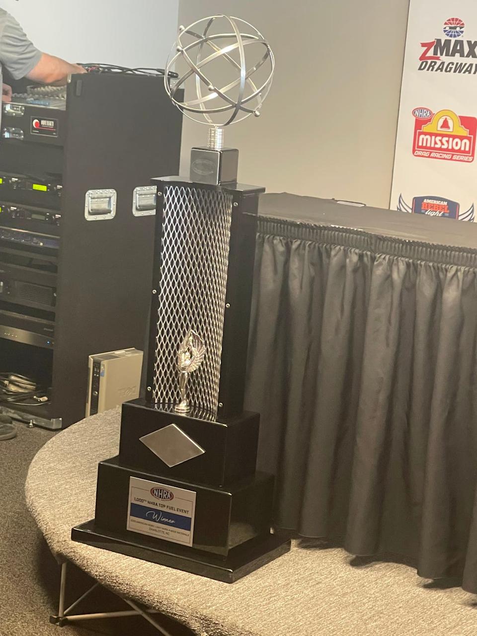 Brittany Force celebrates after her historic Top Fuel speed record at zMAX Dragway