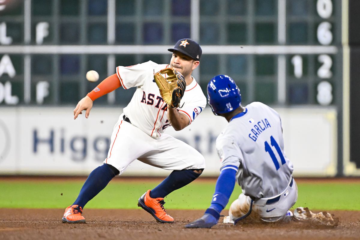 Astros vs Royals game action with players in the dugout