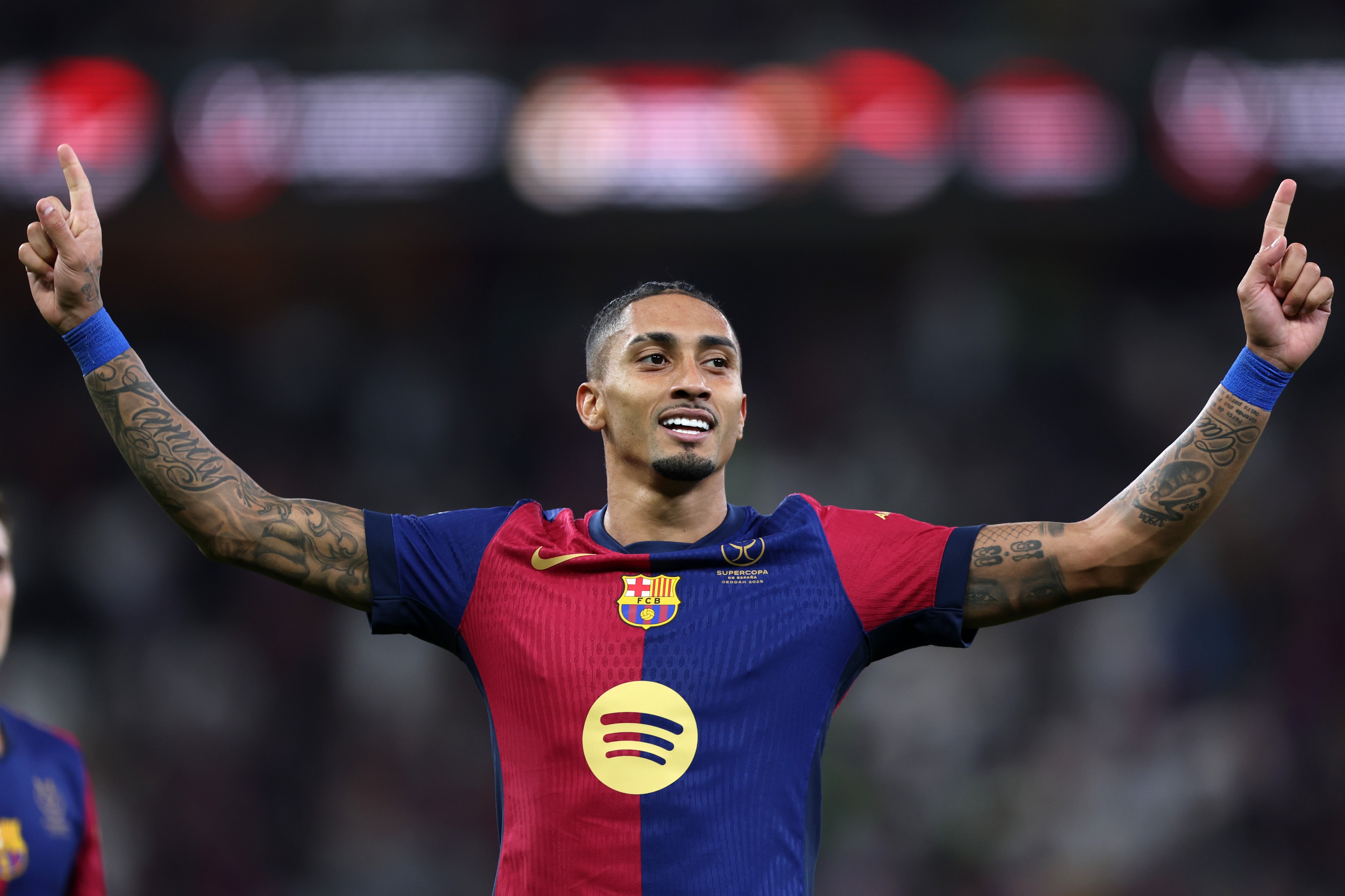 Raphinha celebrates a goal for Barcelona in LaLiga action