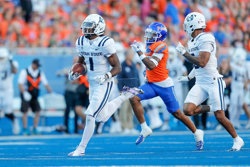 Jalen Royals celebrates a touchdown as Utah State wide receiver in 2023