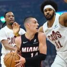 Cavaliers vs Heat playoff action, Donovan Mitchell drives past Heat defenders