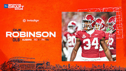 Que Robinson celebrates after being drafted by the Denver Broncos