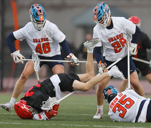 Syracuse lacrosse player defends against North Carolina at the Dome