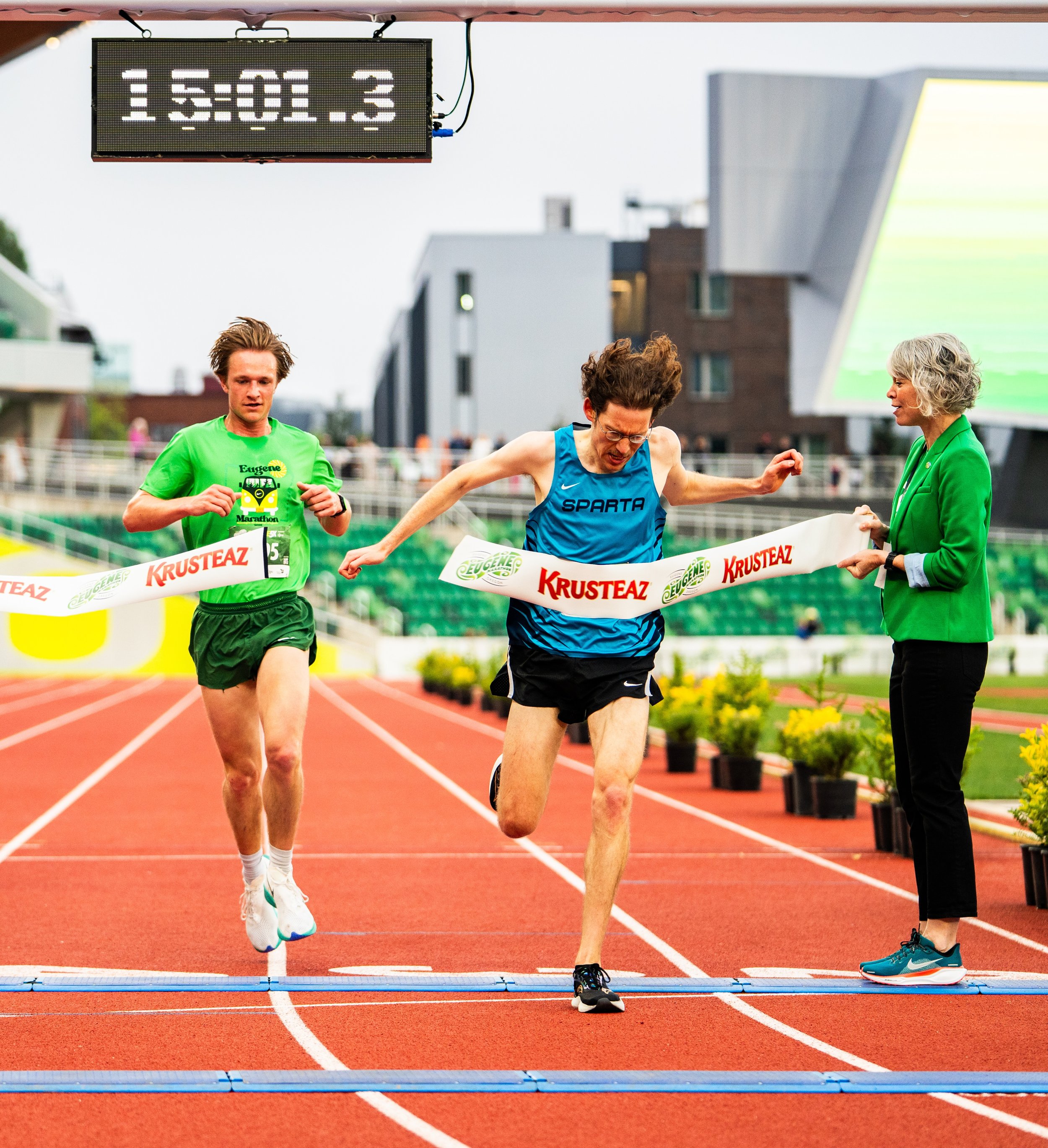 Runners at the Eugene Marathon finish line, Hayward Field, focus keyword: eugene marathon