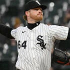 MLB pitcher throws a pitch, aiming for a strikeout