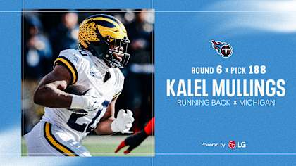 Kalel Mullings rushes past defenders during his standout Michigan career