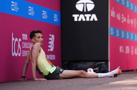 Elite runners embracing after finishing the marathon, celebrating the London Marathon 2025 results