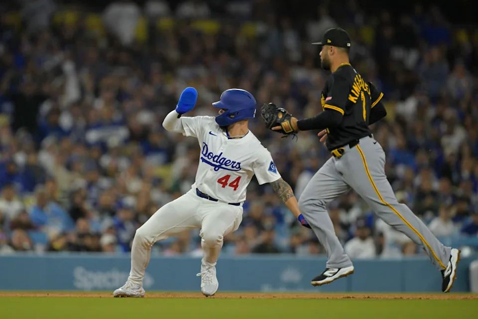 Andy Pages tracks a fly ball in left field, displaying his outfield skills for the Dodgers