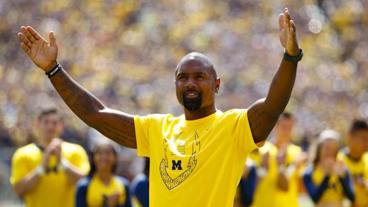 Charles Woodson and his son at a recent football camp