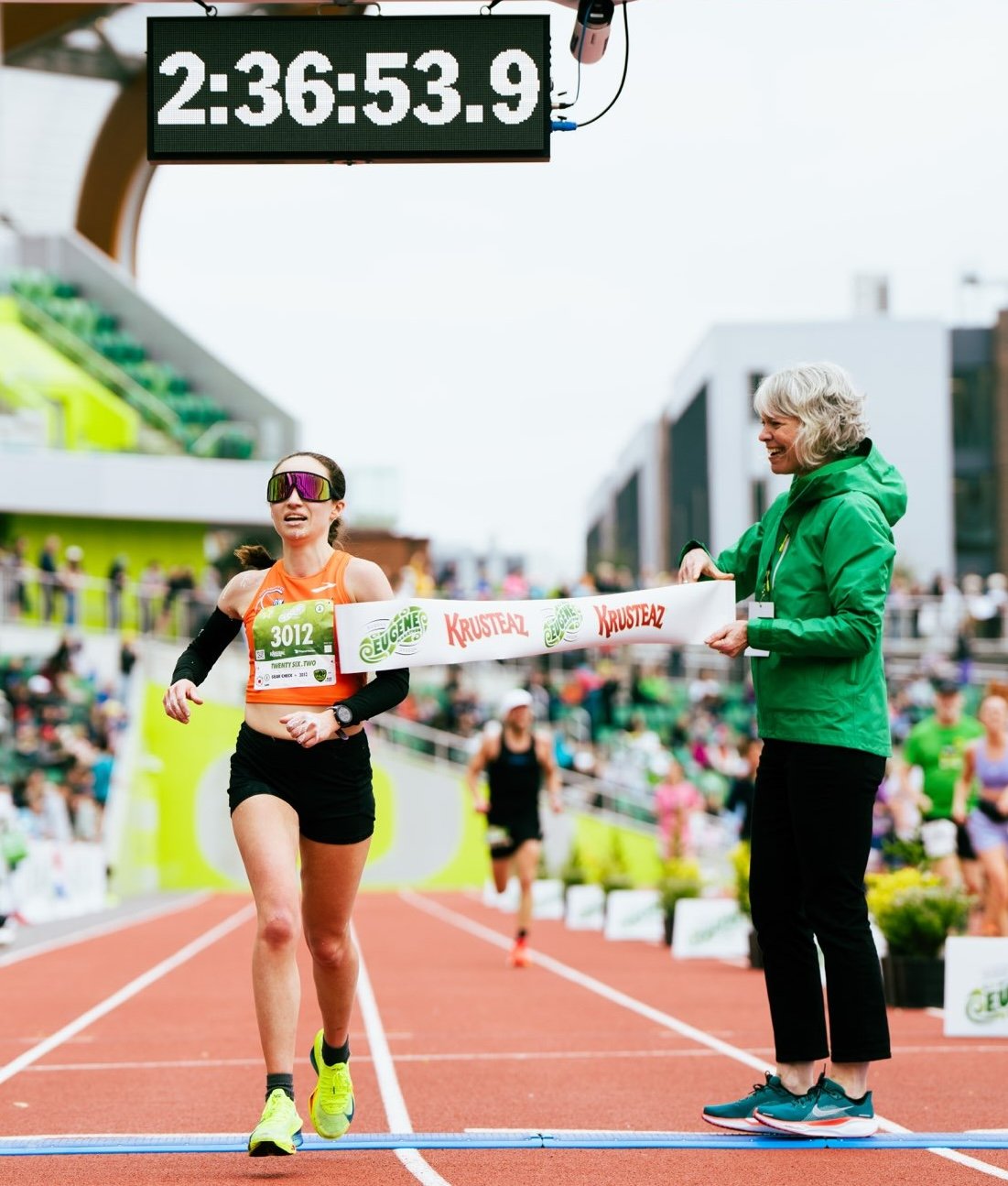 Runners cross the finish line at the 2025 Eugene Marathon in Hayward Field