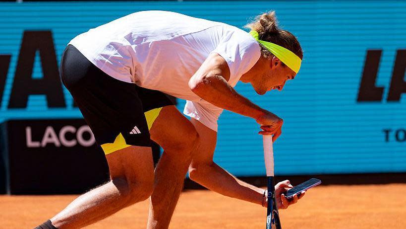 Alexander Zverev argues a line call during the Madrid Open, showing emotion and intensity on the court