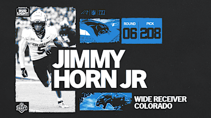 Horn Jr receives his Panthers jersey after the draft