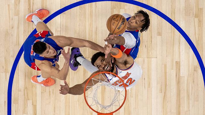 Ron Holland drives to the hoop for the Detroit Pistons in a playoff matchup