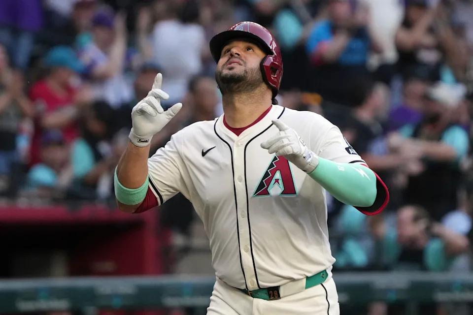 Eugenio Suárez celebrates after one of his four home runs against the Braves, highlighting a historic night for the dbacks