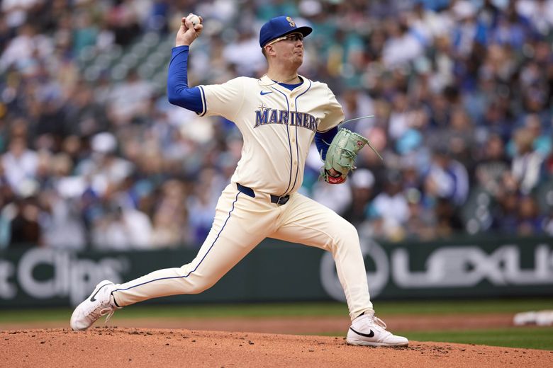 Logan Evans celebrates his MLB debut victory with the Mariners