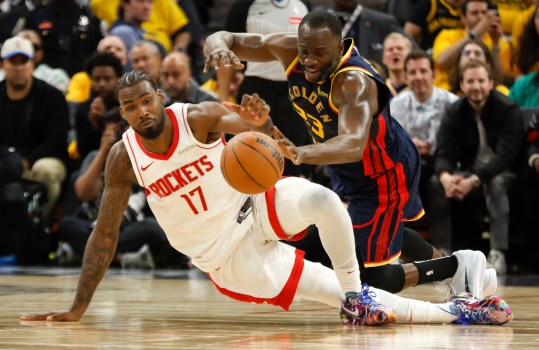 Draymond Green celebrating after a crucial defensive stop in Game 4 of the NBA Playoffs