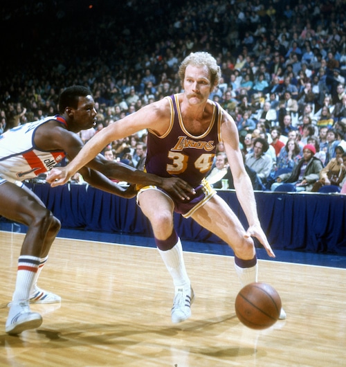 Stan Love during his time with the Los Angeles Lakers, dribbling against the Washington Bullets