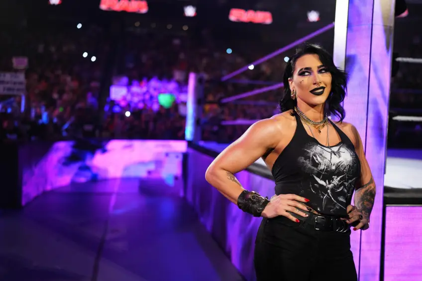 Roxanne Perez celebrates in the WWE ring before her match against Rhea Ripley on Raw.