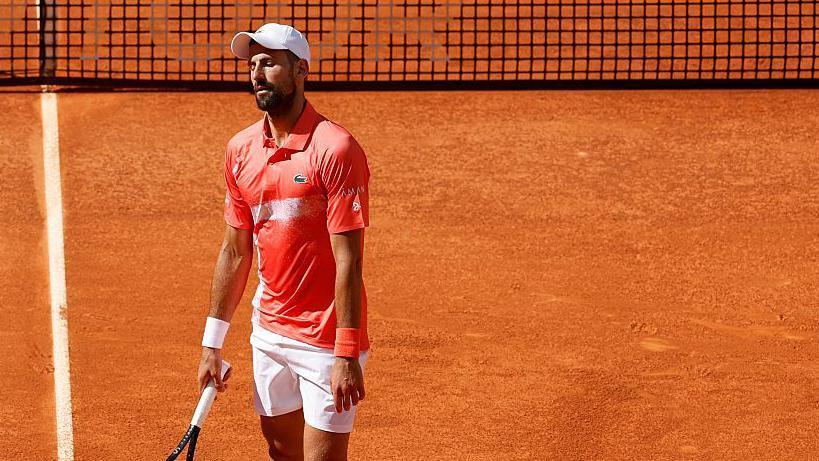 Matteo Arnaldi celebrates his victory at the Madrid Open