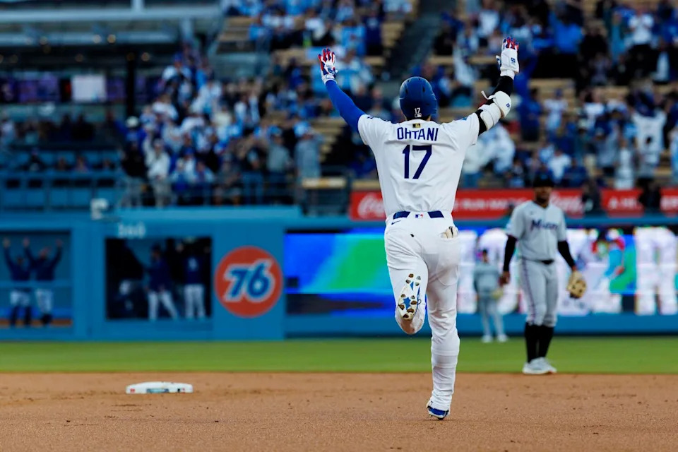 Dodgers players celebrate after victory over the Marlins