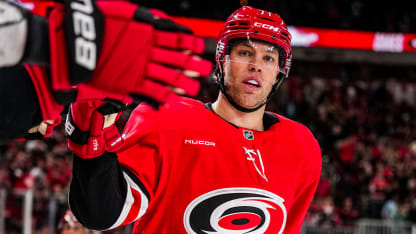 Taylor Hall celebrates a goal with Hurricanes teammates