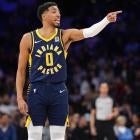 Giannis Antetokounmpo driving against Indiana Pacers defense in Bucks vs Pacers playoff series