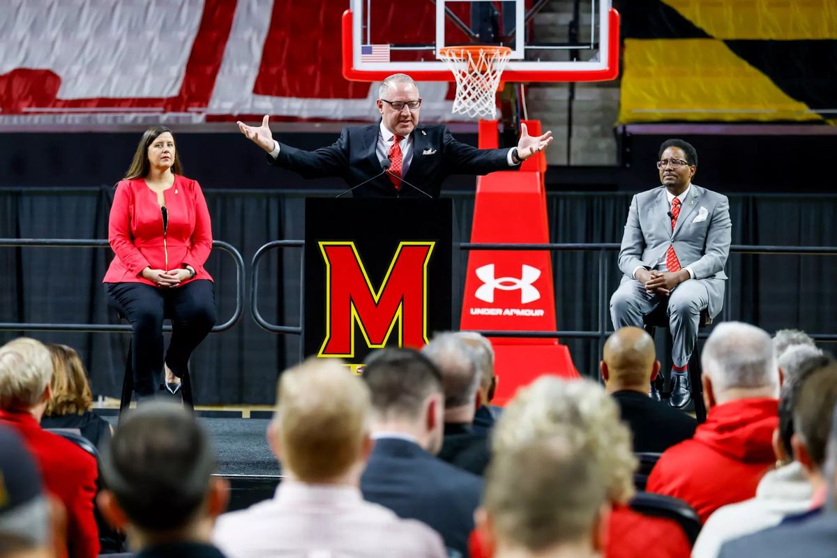 Darius Adams practicing basketball in his Maryland gear