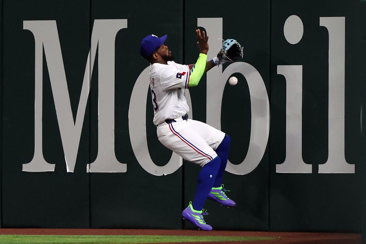 Lawrence Butler celebrates his first career grand slam during an Athletics vs. Rangers game