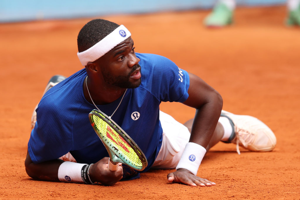 Frances Tiafoe competing at the Madrid Open, showcasing his relentless drive and athletic prowess in 2025.