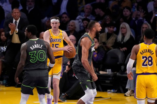 Rudy Gobert soars for a rebound in Game 5, highlighting his rebounding stats against the Lakers