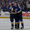 St. Louis Blues playoff action with Jets in the background