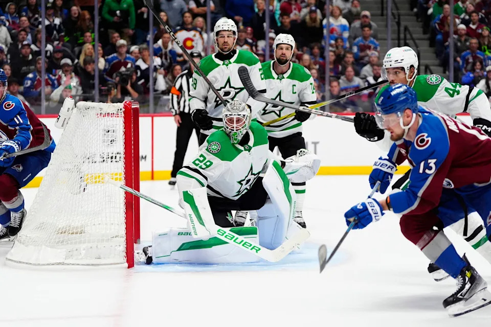 Colorado Avalanche players celebrate after a decisive win against the Dallas Stars in the Stanley Cup Playoffs
