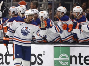 Evander Kane celebrates with teammates in the NHL playoffs