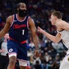 Nikola Jokic and Kawhi Leonard contesting a rebound in Nuggets vs Clippers playoff matchup