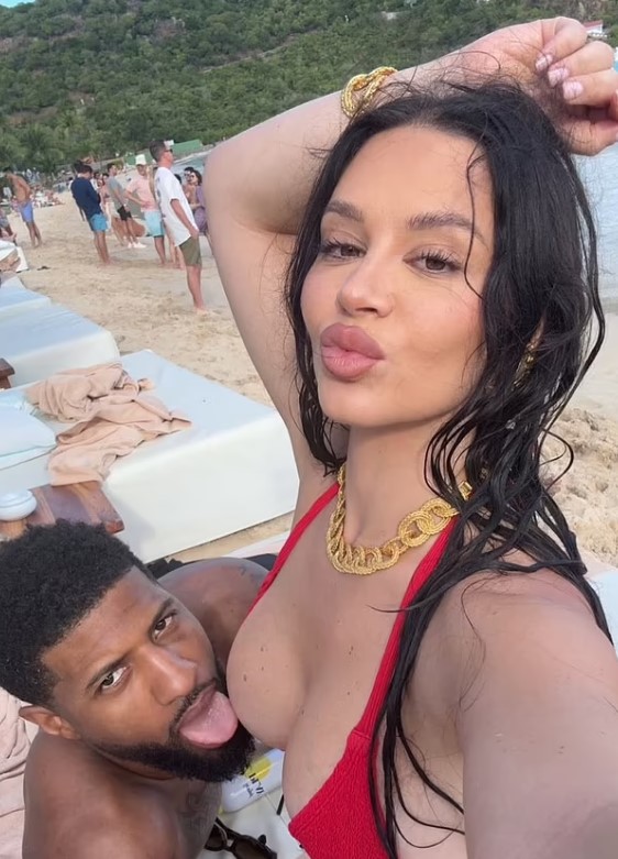 Paul George and Daniela Rajic relax on the beach together after the NBA season.