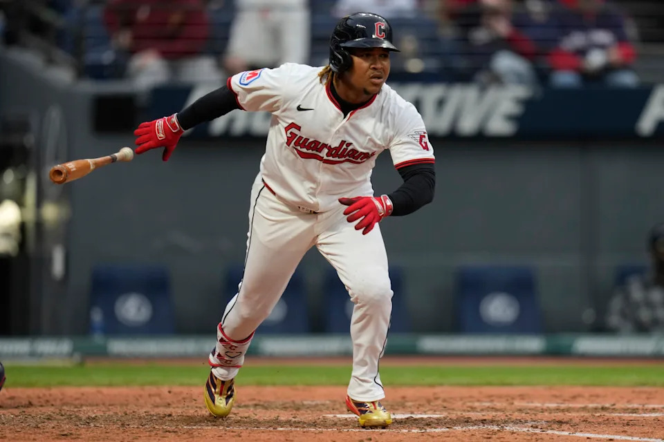 José Ramírez swings during a Cleveland Guardians game, highlighting his historic achievement of reaching 250 home runs and 250 stolen bases.