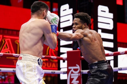 Rolando Romero lands a punch on Ryan Garcia during their Times Square fight