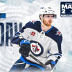 Connor Hellebuyck making a save for the Winnipeg Jets during playoffs