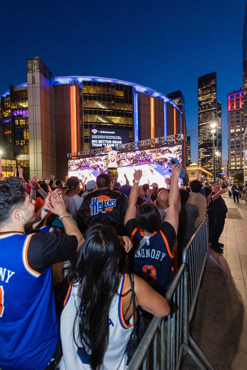Knicks crowd cheering inside Madison Square Garden with a focus on Knicks tickets excitement