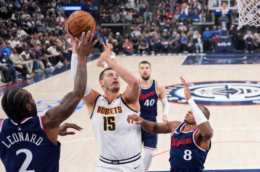 Nikola Jokić battling in the paint during the 2025 NBA Playoffs