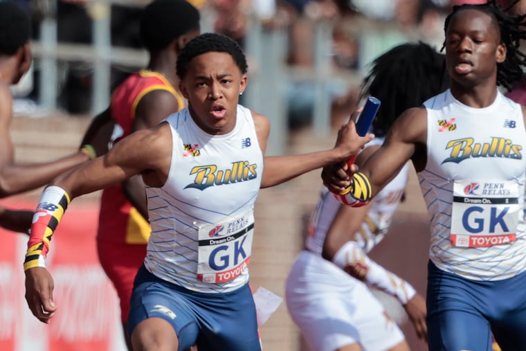 Quincy Wilson sprints in a 4x400m relay at the Penn Relays